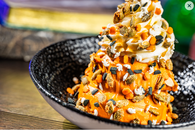 Orange ice cream with sprinkles