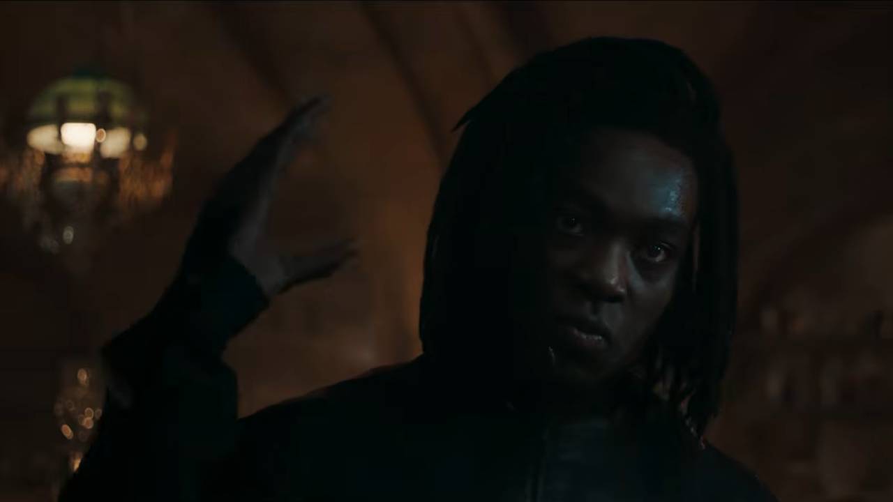 Snape holds his hand up threateningly