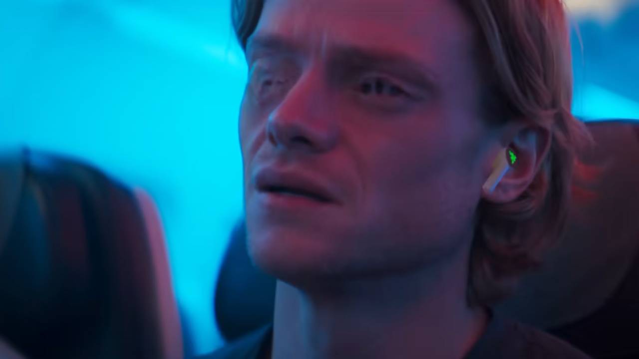 A man with a melting face looking distressed