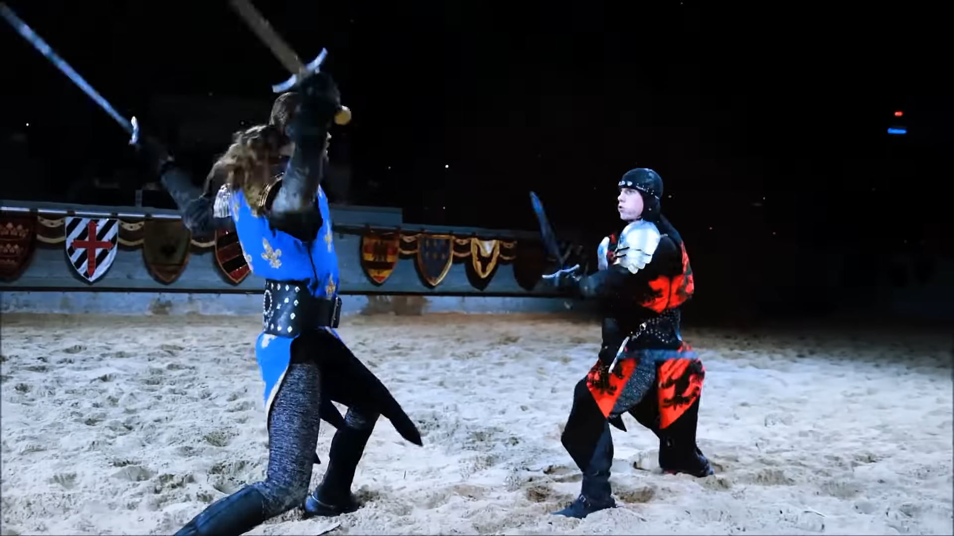 Two men fighting with broadswords 