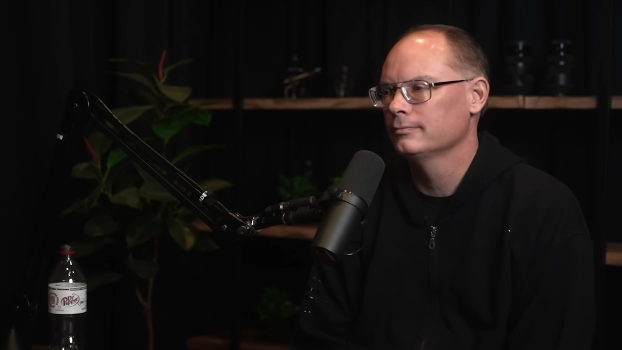 Tim Sweeney seated for a podcast interview