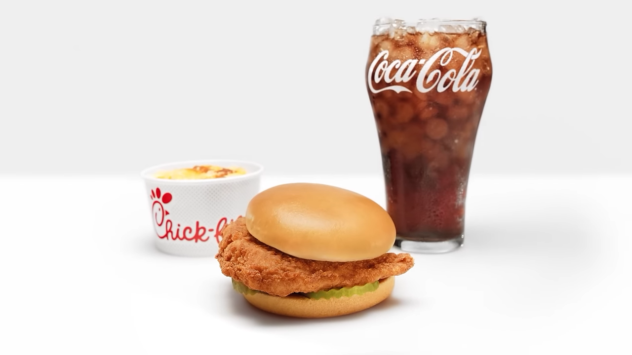 A Chick-fil-A sandwich and a glass of Coca-Cola
