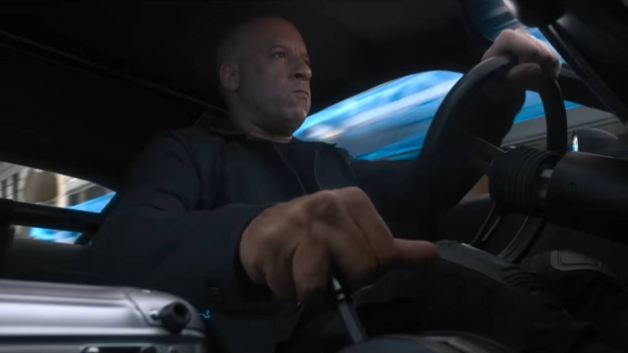 A scowling man driving