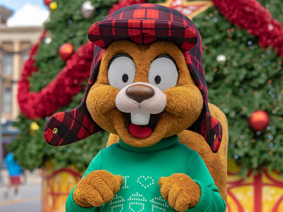 Earl The Squirrel in front of a Christmas tree