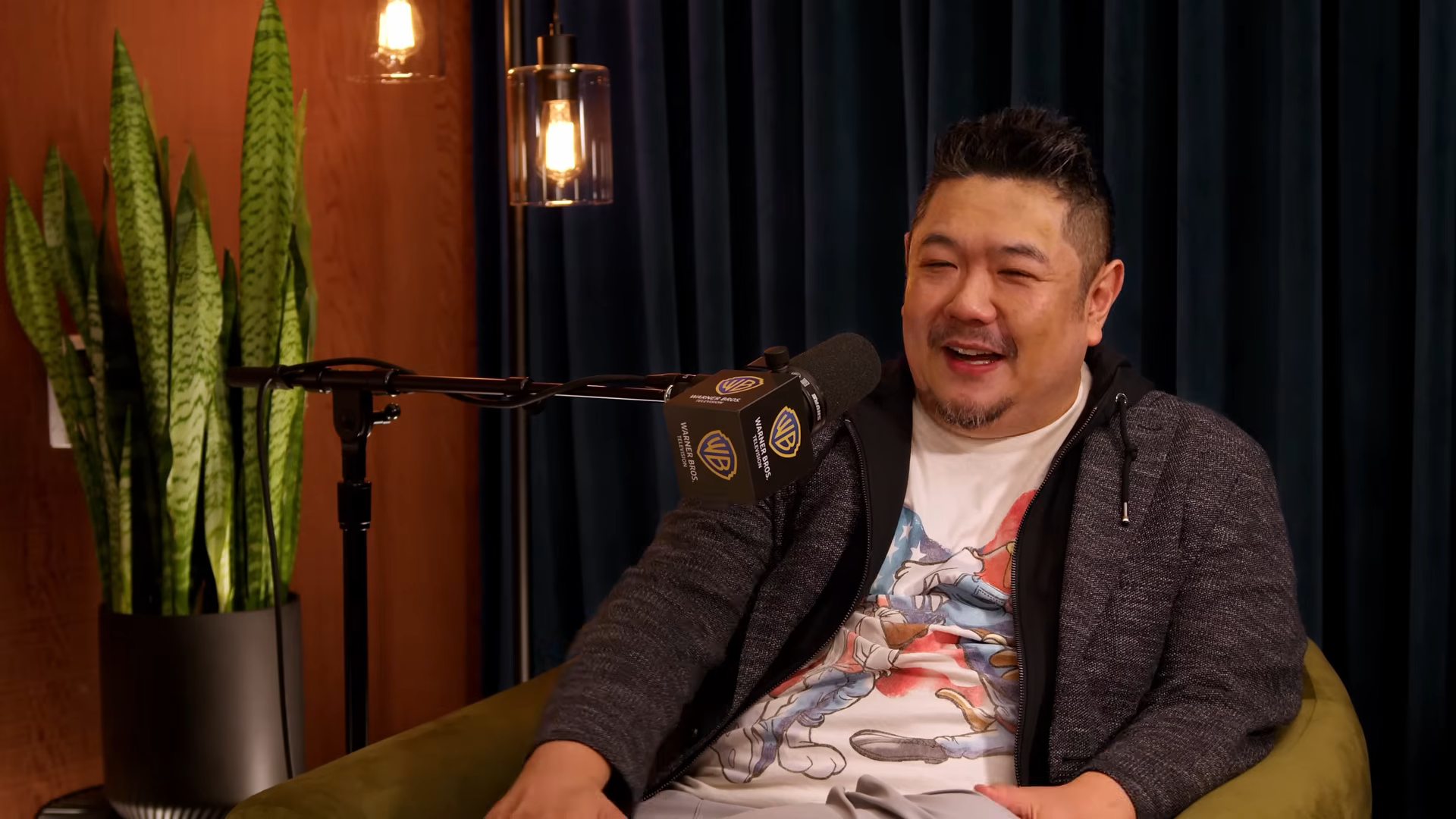 Eric Bauza smiles during a podcast interview