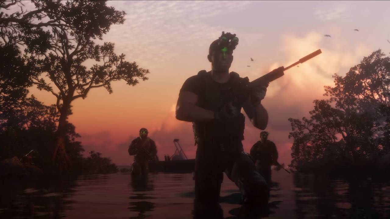 Men in tactical gear walk through a swamp at sunset