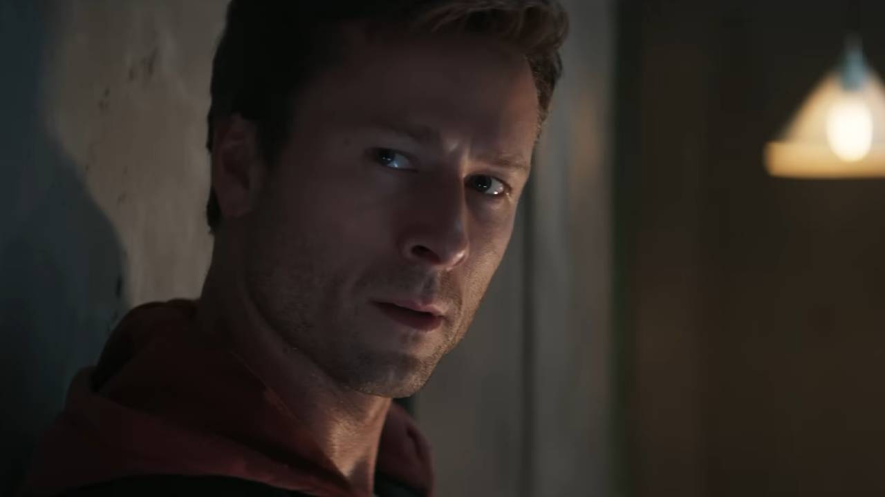 Glen Powell Running Man Glen Powell looks somber