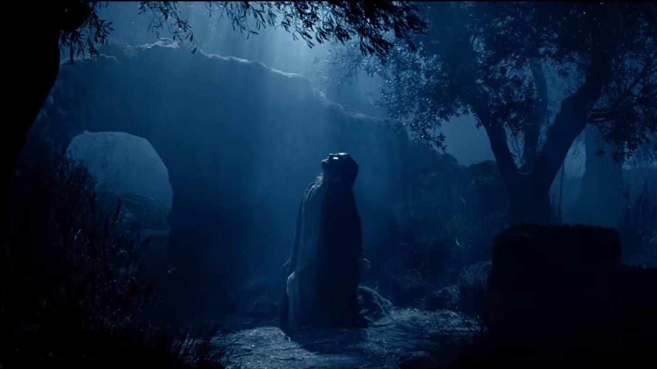 Jesus kneeling in the moonlight