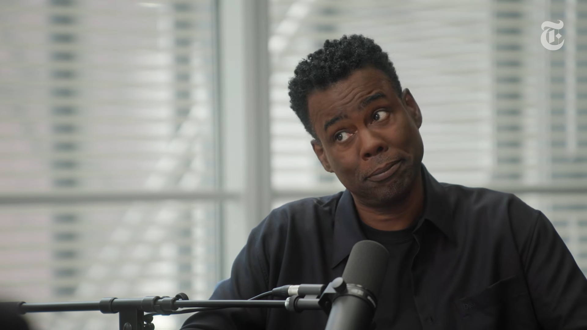 Why Chris Rock Forgives His Canceled Friends The Interview 00-04-46 Chris Rock tilts his head with a half-serious expression