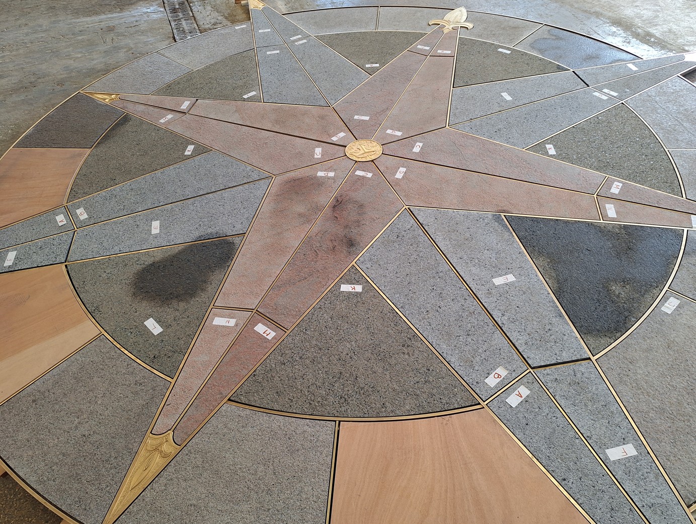 Compass rose stone mosaic for Sleeping Beauty Castle bridge
