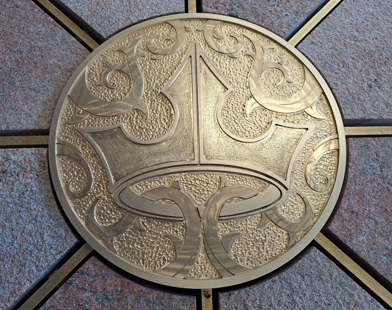 Brass Aurora crown medallion on Sleeping Beauty Castle bridge