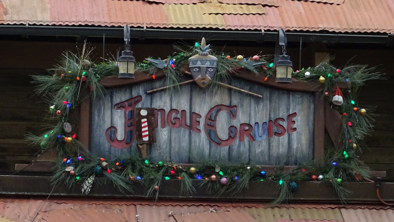 Jingle Cruise sign banner 1280×720 Banner crop of the Jingle Cruise sign with holiday garland at Magic Kingdom