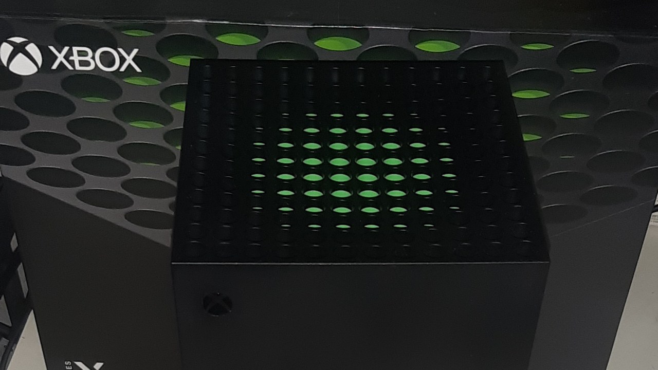 Top of an Xbox Series X console next to its box