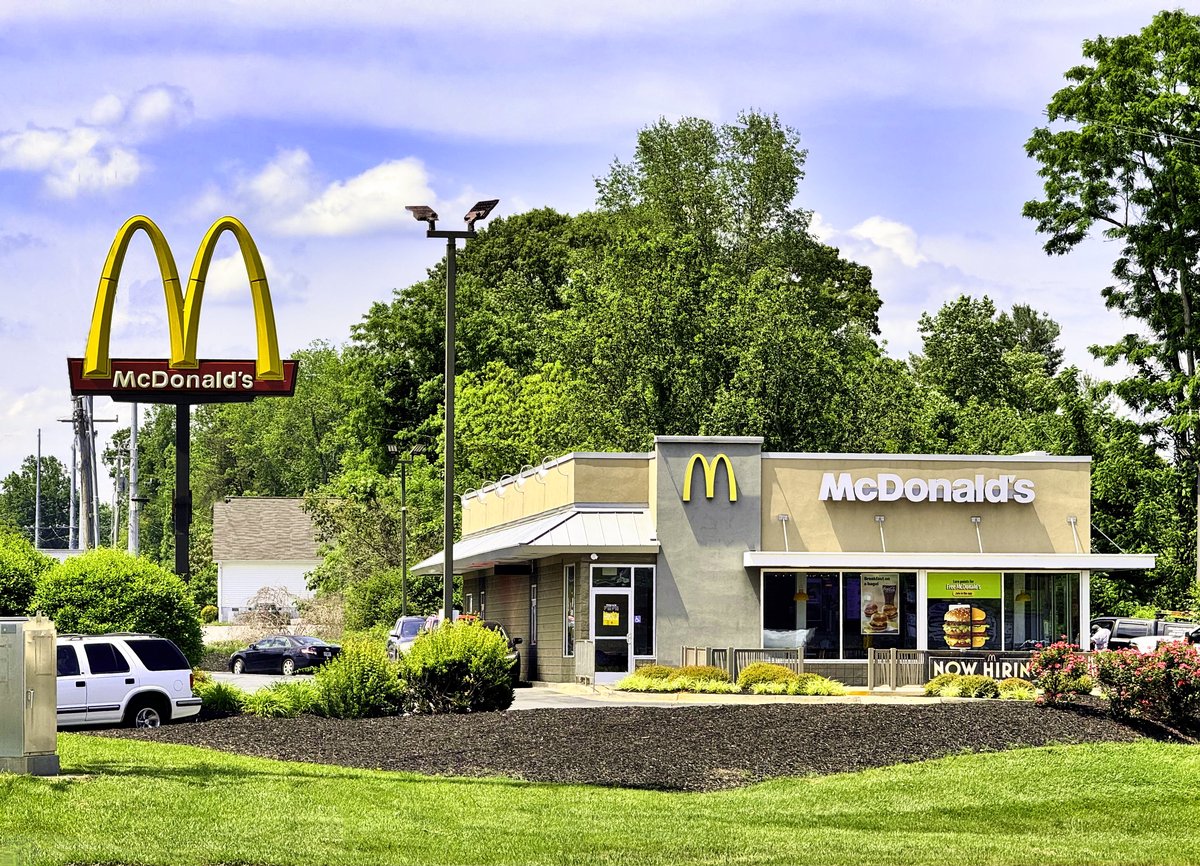 A modern McDonald's restaurant with golden arches sign in Georgia