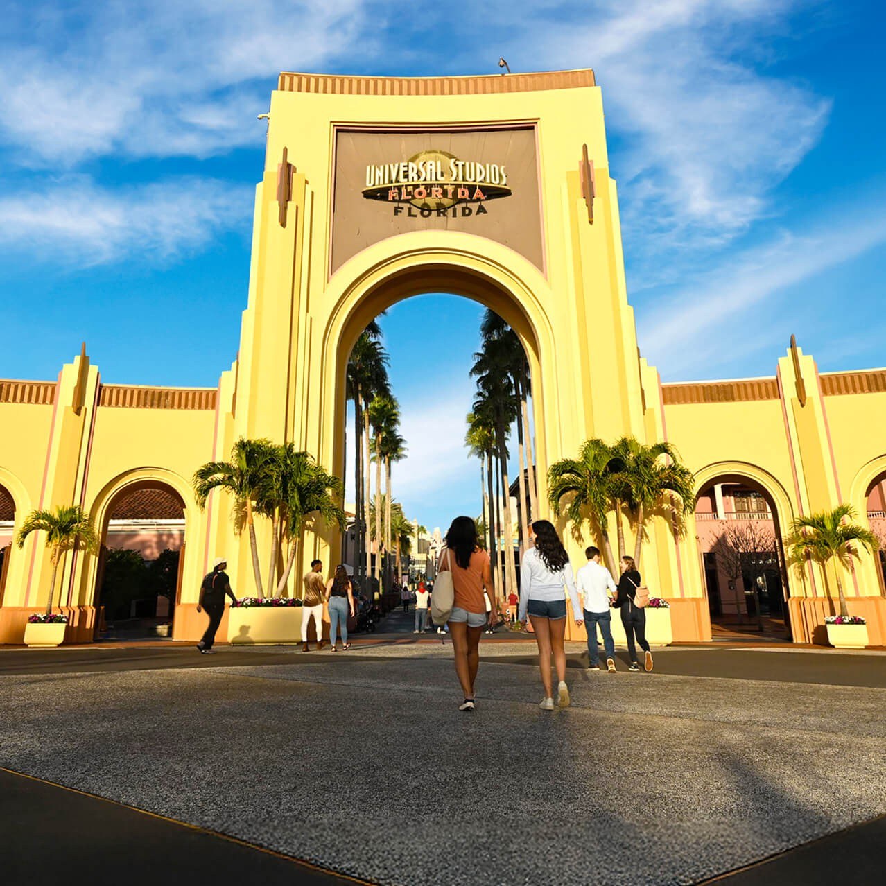 The Universal Studios Florida entrance arch with palm trees