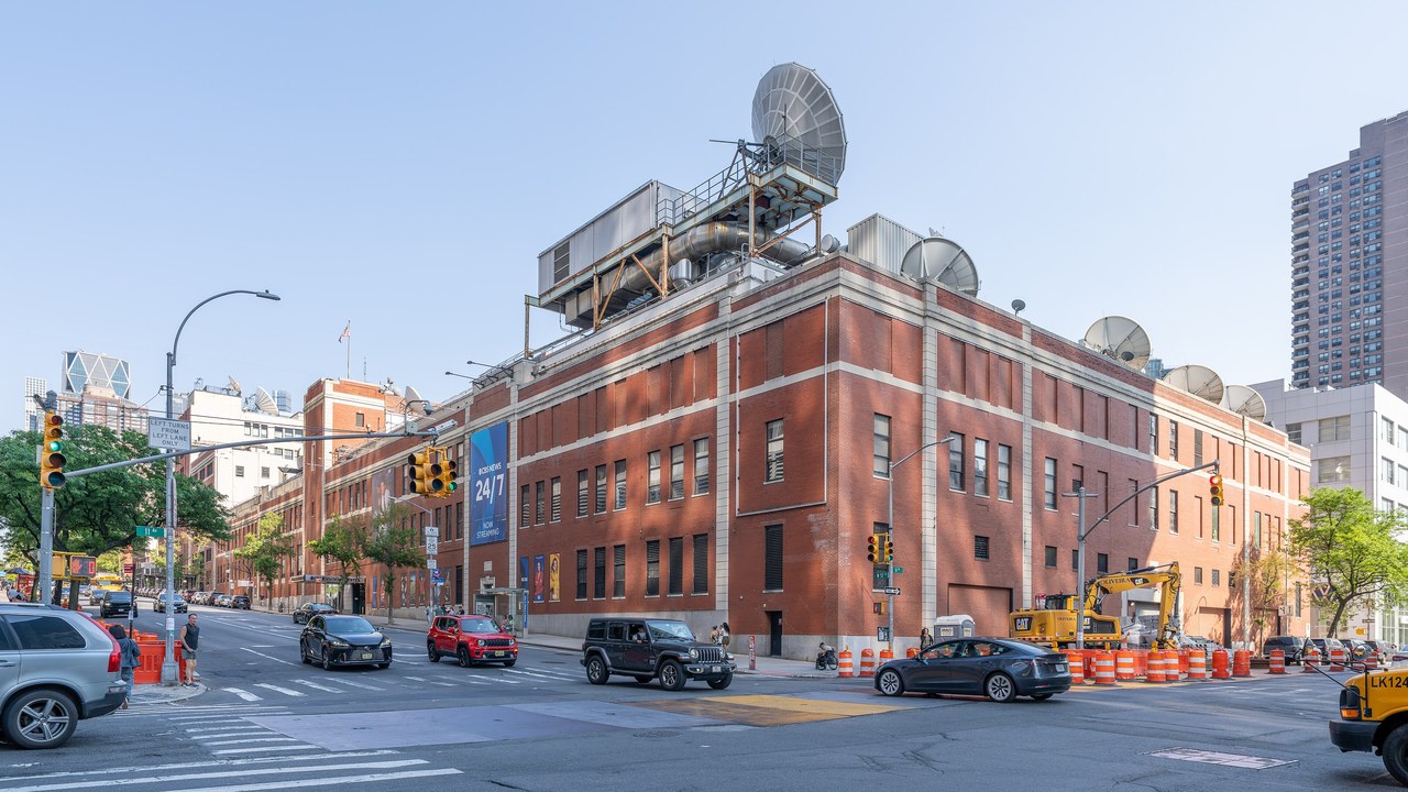 The red brick CBS Broadcast Center building on a New York City street corner