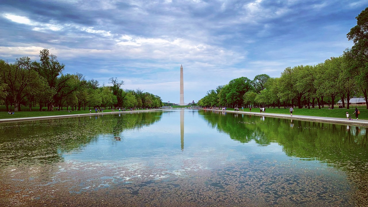 Lincoln Memorial Reflecting Pool featured 1280×720 The Lincoln Memorial Reflecting Pool leading to the Washington Monument under a cloudy sky