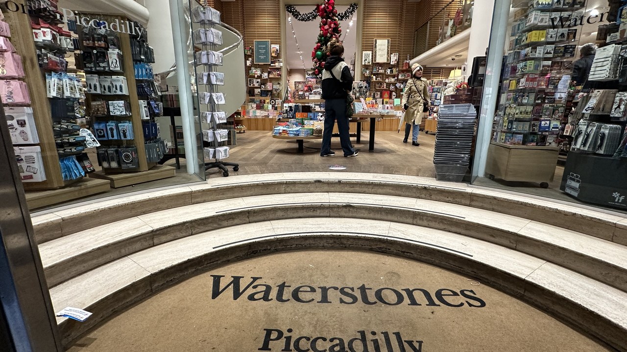 The entrance steps of the Waterstones Piccadilly bookstore in London with the store name set into the floor