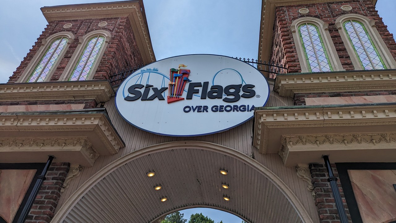 The Six Flags Over Georgia sign above the park's brick entrance gate
