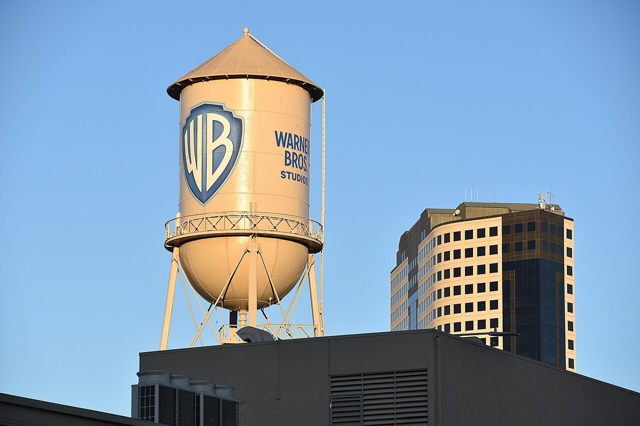 The Warner Bros. Studios water tower in Burbank against a blue sky